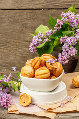 Cookies in the shape of walnuts with condensed milk cream filling.Delicious shortbread sandwiches