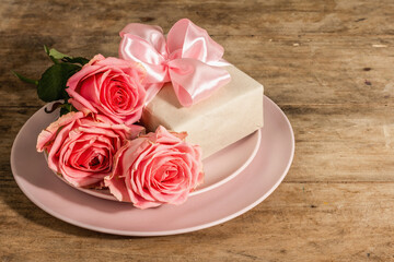 Romantic dinner table on rustic background. Love cutlery for Valentine's or Mother's day, Wedding