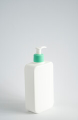Blank body cream, lotion, shampoo or shower gel bottle photo. White plastic container isolated on white background.