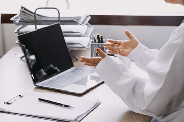 Fototapeta premium Homecare nursing service and elderly people cardiology healthcare. Close up of young hispanic female doctor nurse check mature caucasian man patient heartbeat using stethoscope during visit