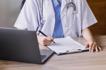 Homecare nursing service and elderly people cardiology healthcare. Close up of young hispanic female doctor nurse check mature caucasian man patient heartbeat using stethoscope during visit