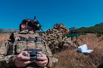 Sniper soldier assisted by an assistant to observe the area to be targeted with modern warfare...