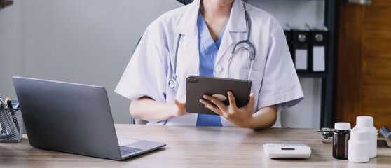 Homecare nursing service and elderly people cardiology healthcare. Close up of young hispanic female doctor nurse check mature caucasian man patient heartbeat using stethoscope during visit