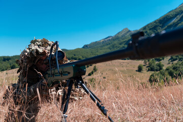 Army soldier holding sniper rifle with scope and aiming in forest. War, army, technology and people...