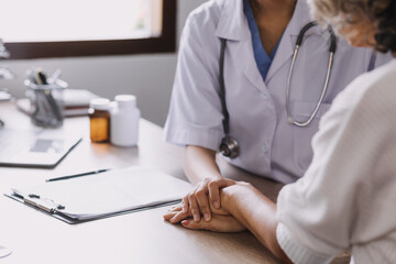 Homecare nursing service and elderly people cardiology healthcare. Close up of young hispanic female doctor nurse check mature caucasian man patient heartbeat using stethoscope during visit