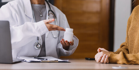 Homecare nursing service and elderly people cardiology healthcare. Close up of young hispanic female doctor nurse check mature caucasian man patient heartbeat using stethoscope during visit