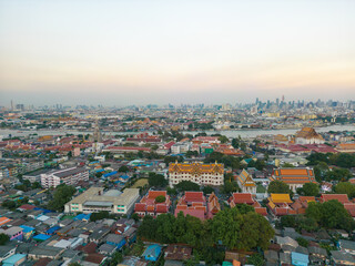 Fototapeta na wymiar Aerial view Bangkok city buddhist temple with river sunset sky