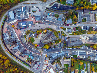 Fototapeta premium Aerial drone Shot of town CLervaux on the north of Luxembourg. Twilight evening scene with Castle and Cathedral