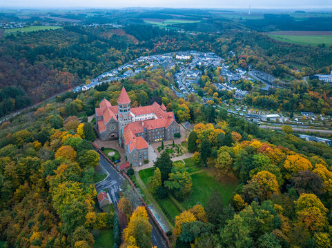 Aerial drone Shot of Abbey in Clervaux, Luxembourg in mystery evening twilight 