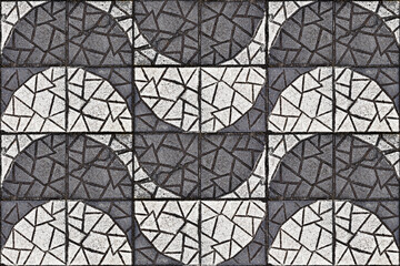 Black and white textured concrete blocks on floor