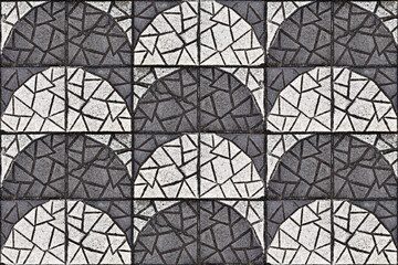 Black and white textured concrete blocks on floor