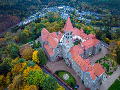 Aerial drone Shot of Abbey in Clervaux, Luxembourg in mystery evening twilight 