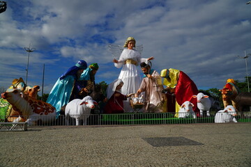 Public Christmas decoration on Amazon River beach. Xmas deco with figures of Nativity and Jesus in Ponta Negra district of Manaus, Brazil.