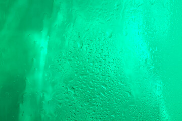 Drops of rain water droplets on glass