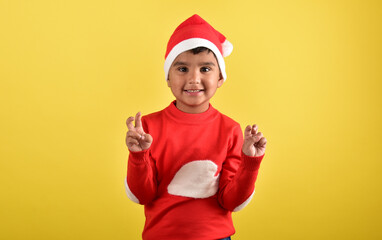 child boy wearing santa cap