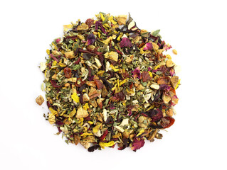 Fruit tea with rose petals and dried fruits top view. Tea with citruses and yellow flower petals. a pile of Dry Herbal Tea. Natural pieces of strawberries, orange peel, rose petals and calendula.