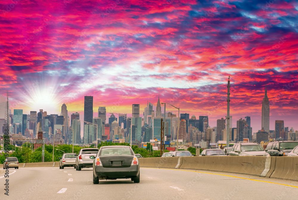 Canvas Prints Major road to New York City at sunset. Car traffic at dusk