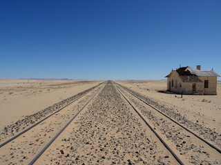 Abandoned railway tracks and station in the desert of Namibia