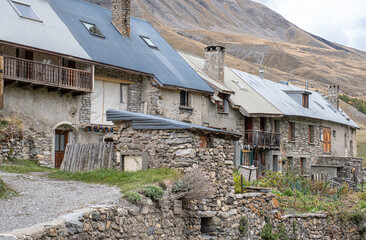 View of the small village of Les Cours, above Lac du Pontet, near Villar d'Arene and Col du...