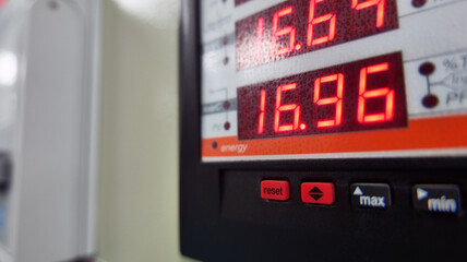 Electric control cabinet with control buttons and lamps indicating the various operating status...