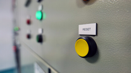 Control buttons and light indicating the work status installed in front of the electric control cabinet installed in the electric control room. Automatic Industry Concept Energy and industrial use