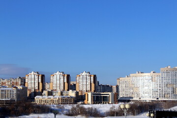 Fototapeta premium .Winter cityscape with houses on a sunny frosty day.