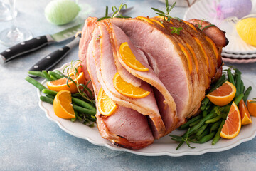 Easter ham stuffed with orange slices, spiral sliced glazed ham