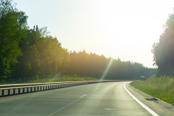 Highway wide road in the city, transport and blue sky with clouds on a summer day