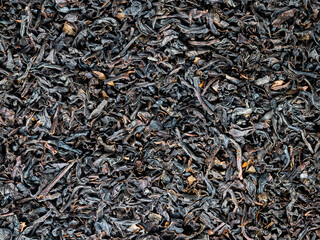 dried black tea leaves background