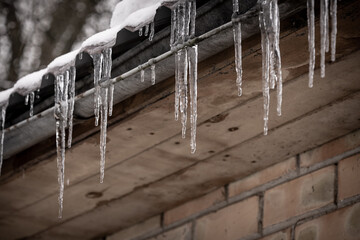winter icicles haging from roof