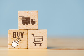 Wooden cubes showing symbols of online shopping and home delivery