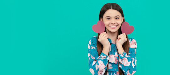 cheerful teen girl hold red heart symbol of love for valentines day, valentines day. Kid girl portrait with heart love symbol, horizontal poster. Banner header with copy space.