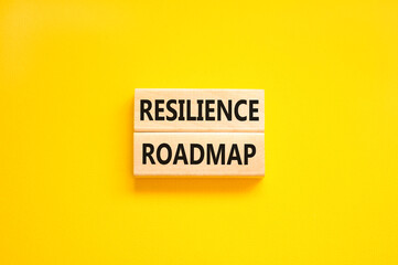 Resilience roadmap symbol. Concept word Resilience roadmap typed on wooden blocks. Beautiful yellow...