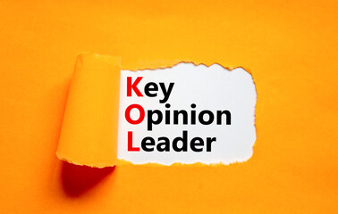 KOL key opinion leader symbol. Concept words KOL key opinion leader on white paper on a beautiful orange background. Business KOL key opinion leader concept. Copy space.