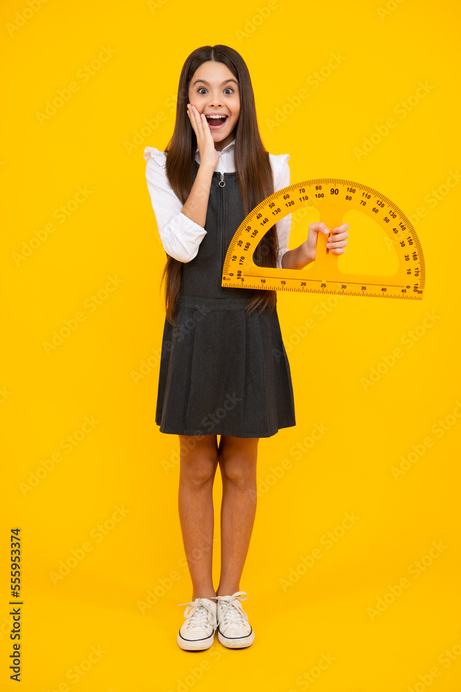 Poster measuring school equipment. schoolgirl holding measure for geometry lesson, isolated on yellow backg