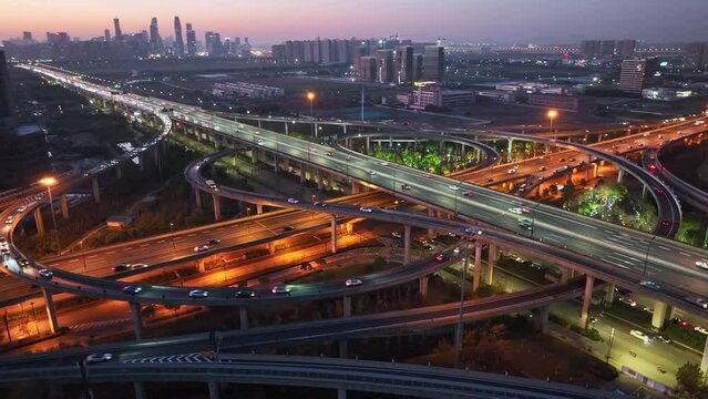 Aerial top view photo of highway multilevel junction road in urban at night