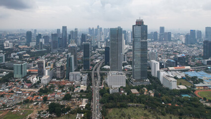 Fototapeta na wymiar Aerial view of Asia Business concept for real estate - panoramic modern cityscape building bird eye aerial view and morning blue bright sky in Jakarta. 
