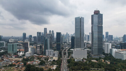 Fototapeta na wymiar Aerial view of Asia Business concept for real estate - panoramic modern cityscape building bird eye aerial view and morning blue bright sky in Jakarta. 