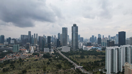 Aerial view of Asia Business concept for real estate - panoramic modern cityscape building bird eye aerial view and morning blue bright sky in Jakarta. 
