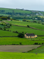 Obraz premium Picturesque countryside. Green farm fields, landscape. Beautiful Irish nature.