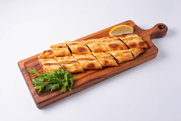 Turkish dish Pide with minced meat and vegetables on a white background