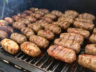 Leskovacki cevapi, small sausage links on a grill