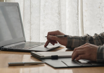A man's hands typing on notebook. Man working in the office