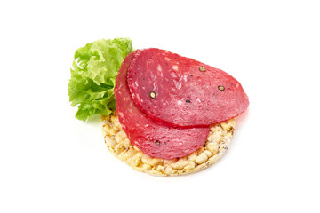 Spanish salchichon sausage, isolated on white background.