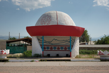 Kyrgyz bus stop in the shape of traditional central asian kalpak hat, Kyrgyzstan