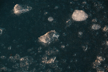Blue color of frozen water as ice during freezing temperature.