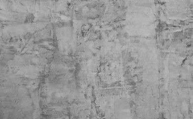Abstract background from a wall covered with gray plaster.