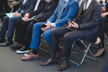 Audience at the conference hall listens to lecturer, people on a congress together listen to...