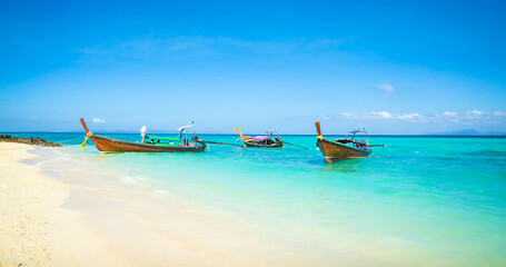 Traditional longtail boats near beautiful tropical island Ko Phi Phi, Thailand