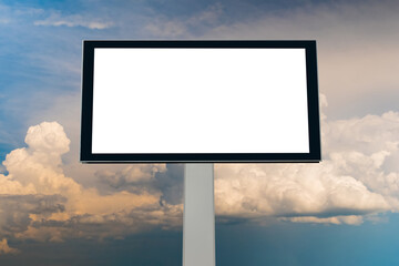 Blank white billboard against warm sunset sky with clouds - mock up. Template, consumerism, advertising, white screen, mockup and copy space concept